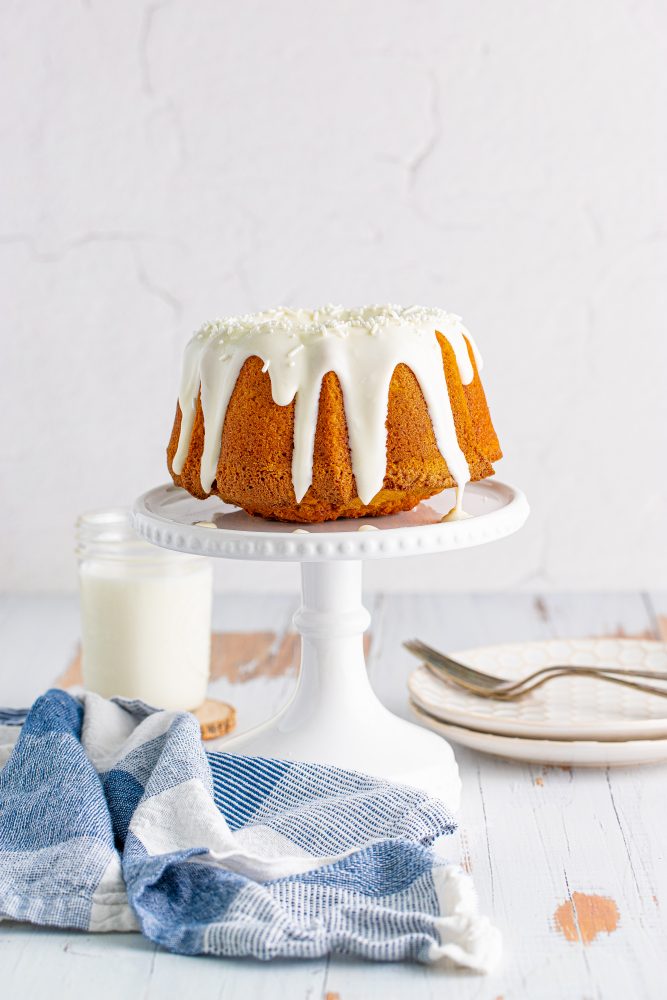 picture of air fryer pumpkin bundt cake on a white cake stand