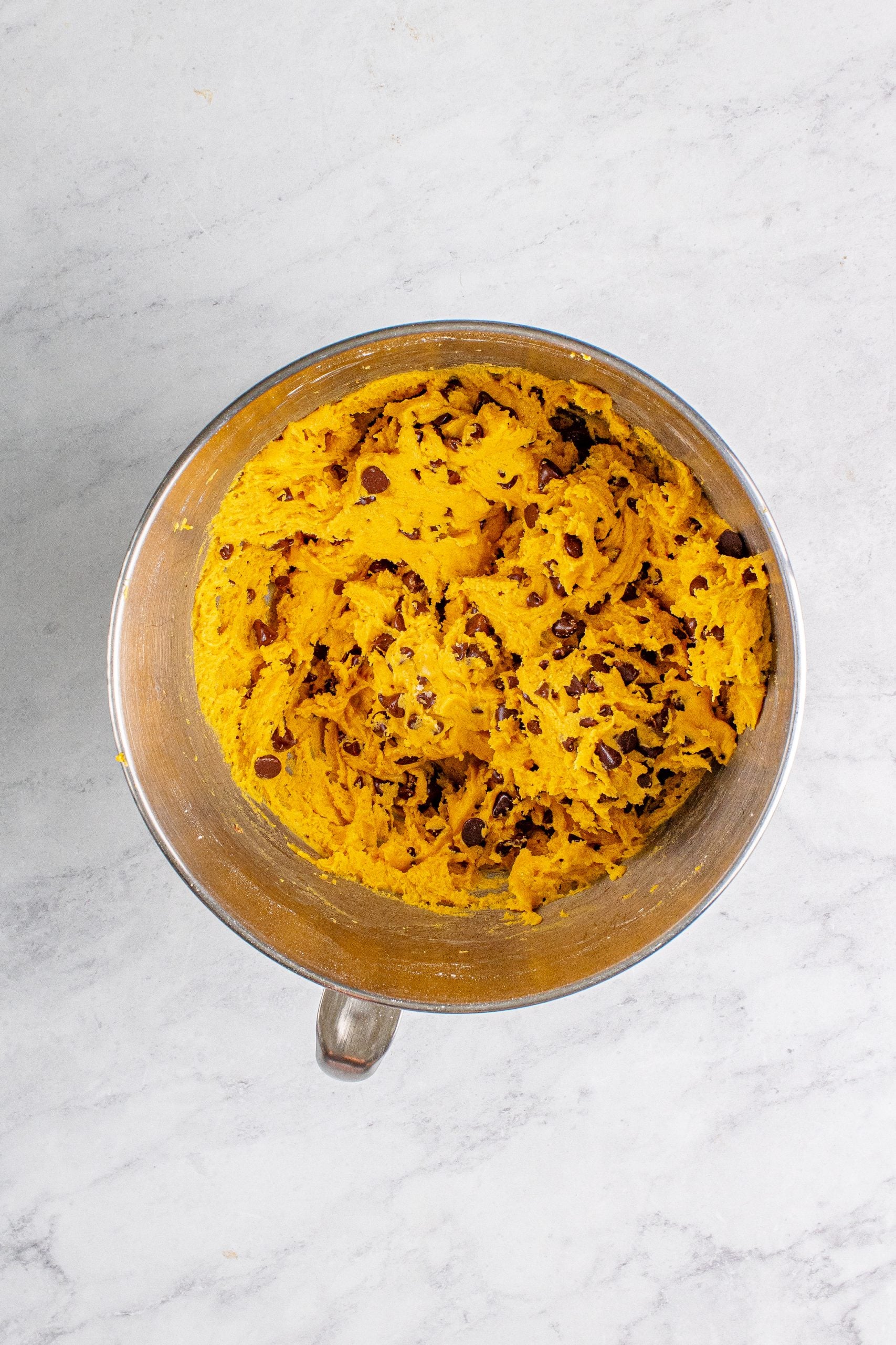 picture of chocolate chip pumpkin cookie dough ingredients in a bowl