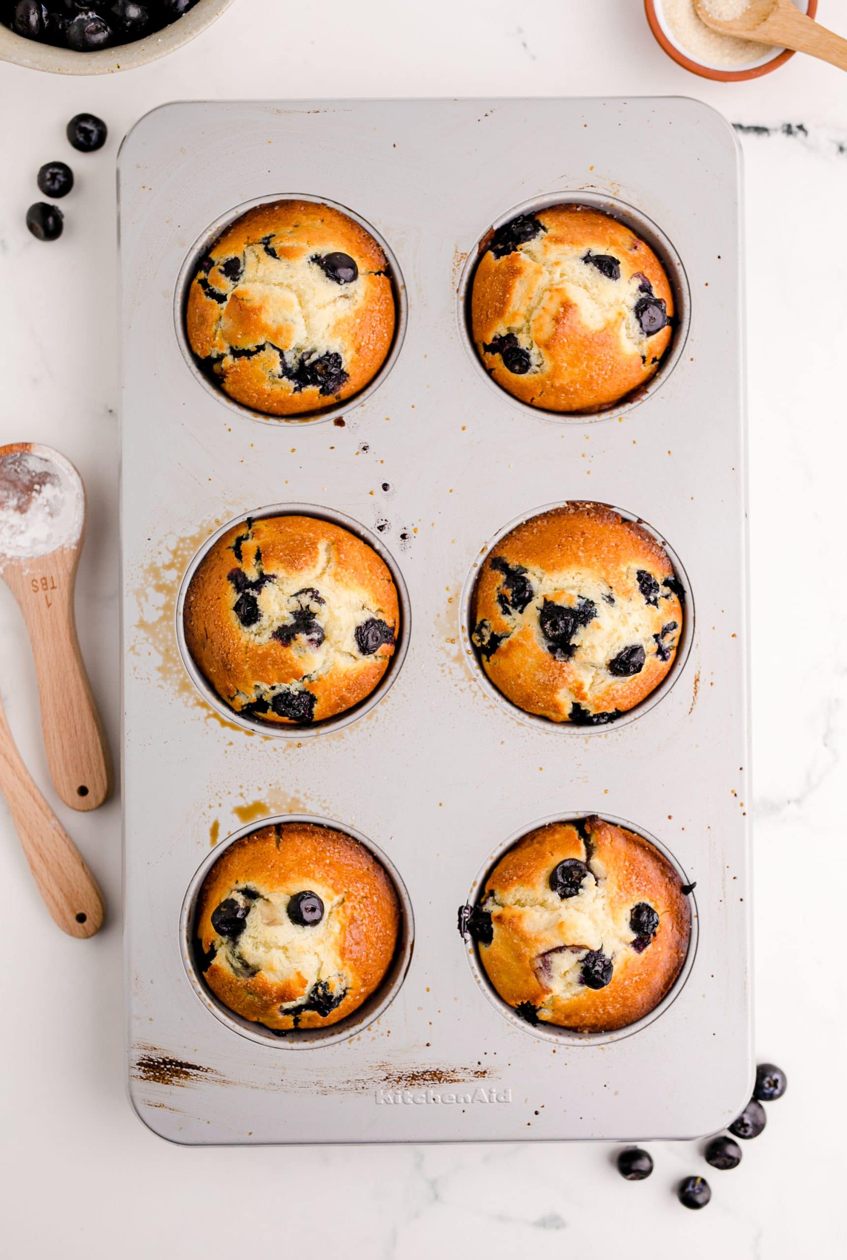 Jumbo Blueberry Muffins in a muffin tin.