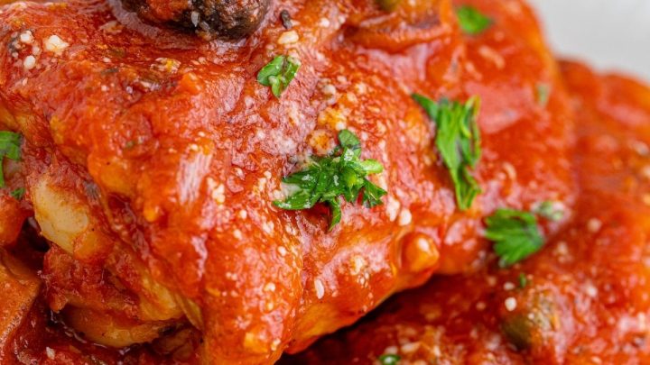 picture of chicken cacciatore piled on a white plate