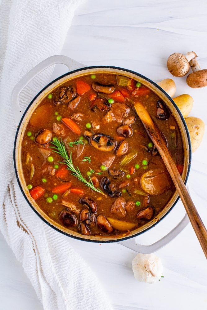 picture of venison stew in a dutch oven 