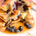 stack of blueberry pancakes with syrup