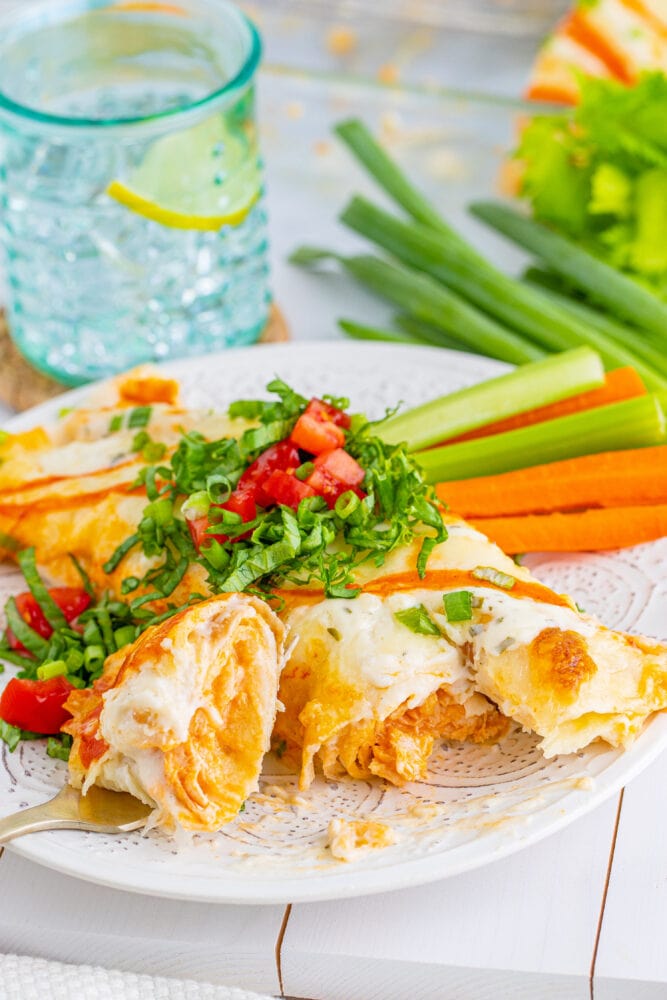 picture of buffalo ranch chicken enchiladas on a plate