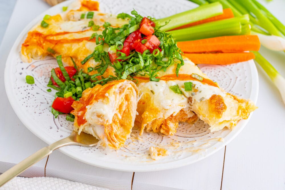 picture of buffalo ranch chicken enchiladas on a plate