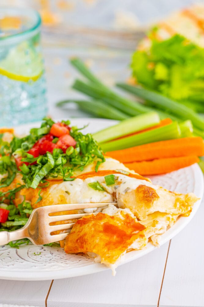 picture of buffalo ranch chicken enchiladas on a plate