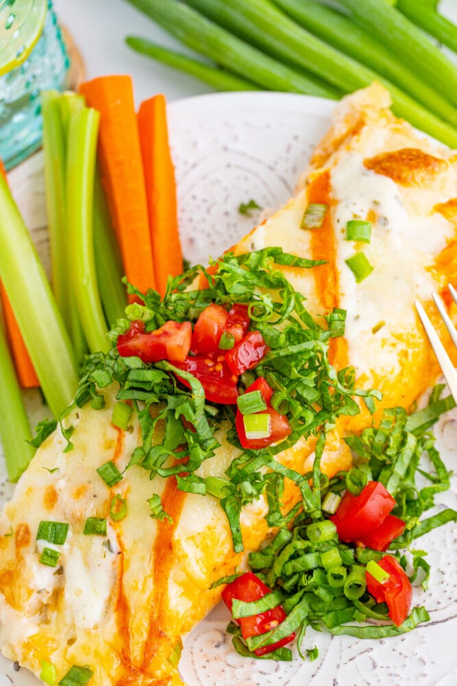 picture of buffalo ranch chicken enchiladas on a plate