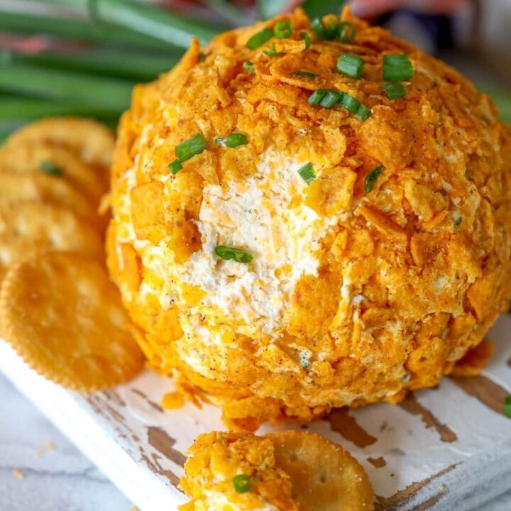 picture of chili cheese frito cheese ball on a wood cutting board