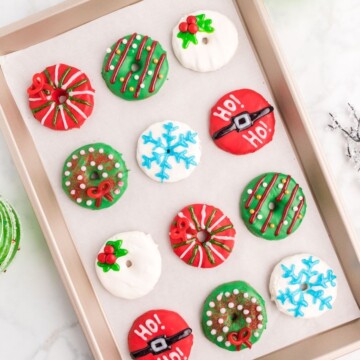 picture of iced cookies that are decorated with candy to look like Christmas wreaths