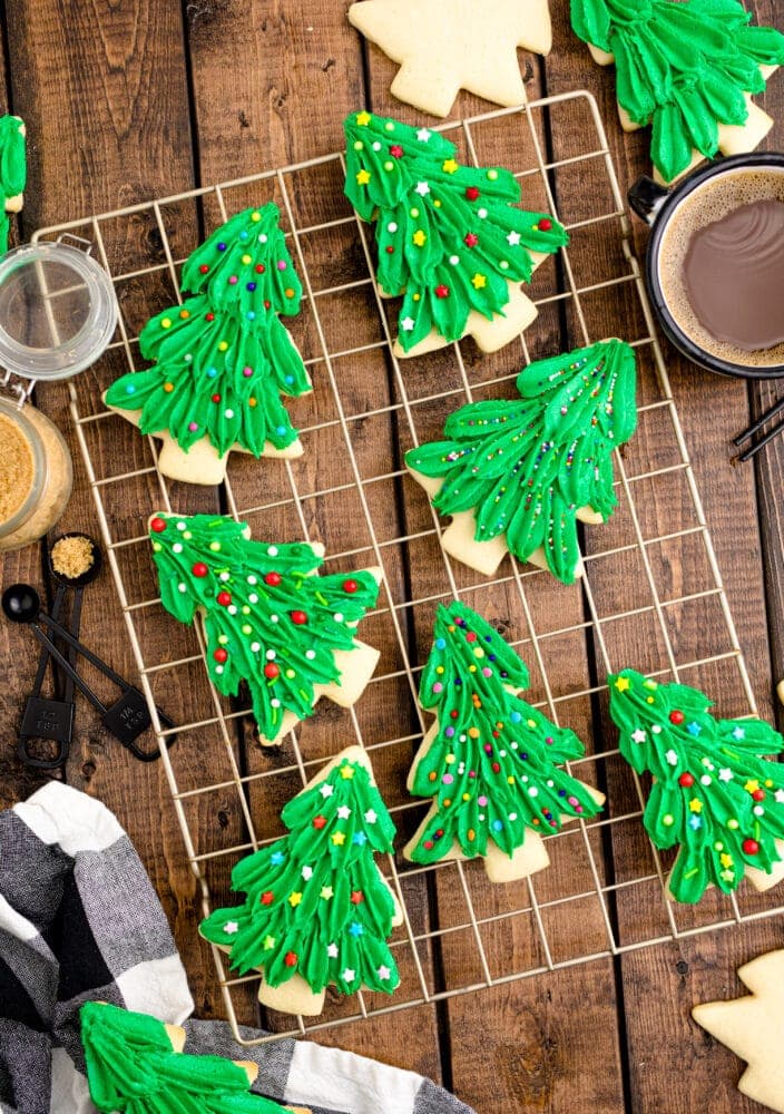picture of iced christmas tree shaped cookie on a cooling rack