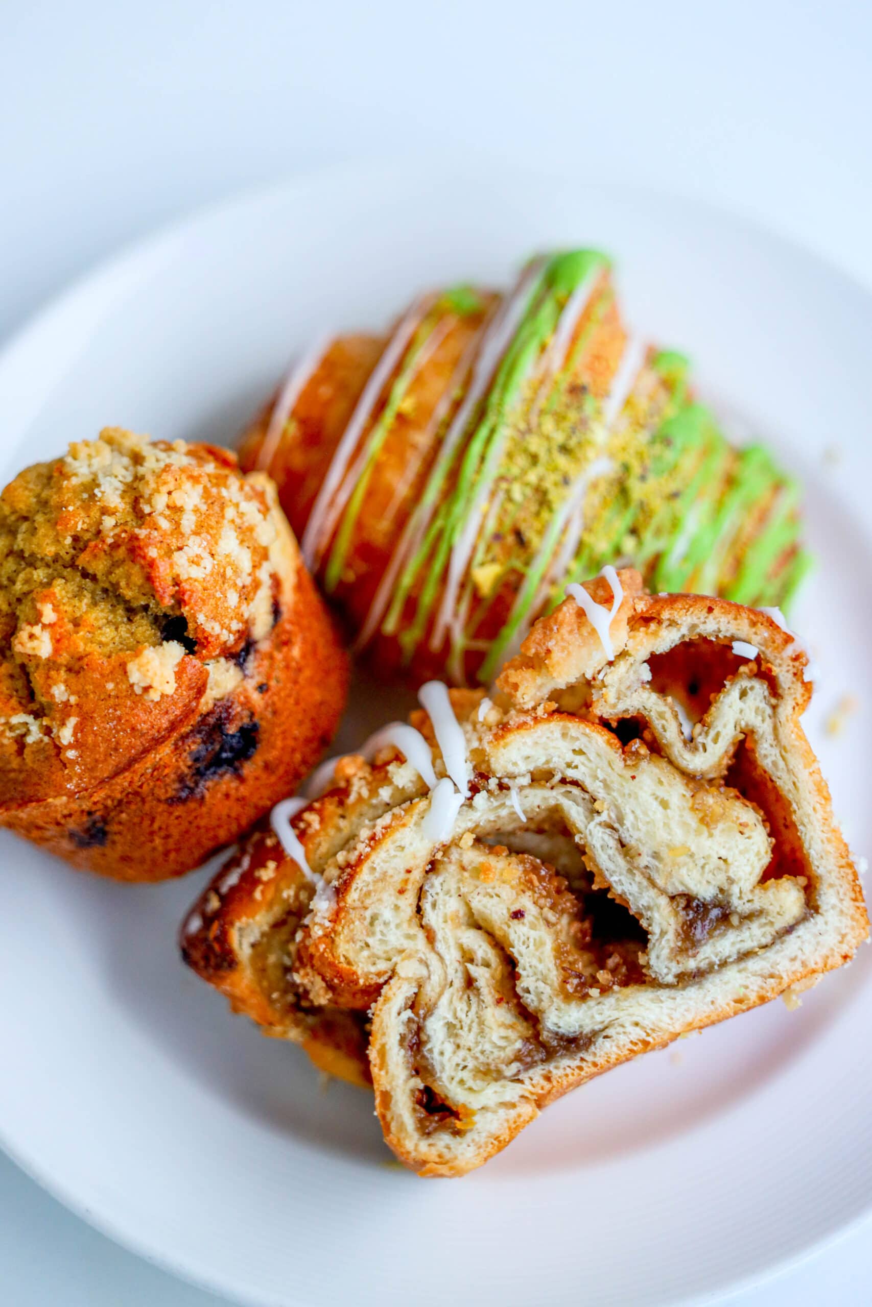 Your Ultimate Dining Guide for the Majestic Princess 37 A diverse assortment of pastries and baked goods on a plate, ready to be enjoyed at the International Cafe.