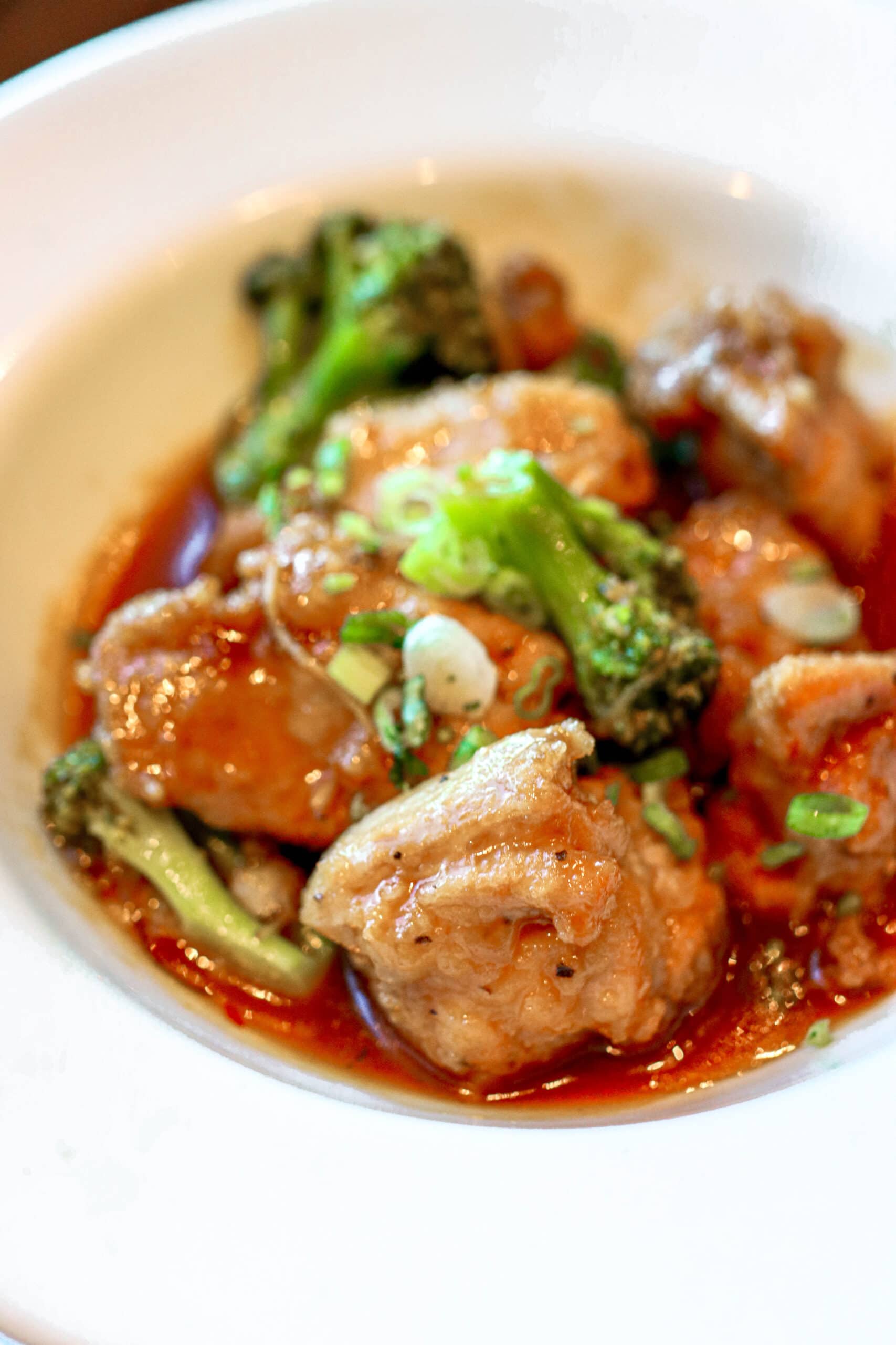 Your Ultimate Dining Guide for the Majestic Princess 16 A delectable plate of chicken and broccoli in a rich, savory sauce, a culinary delight on Majestic Princess.