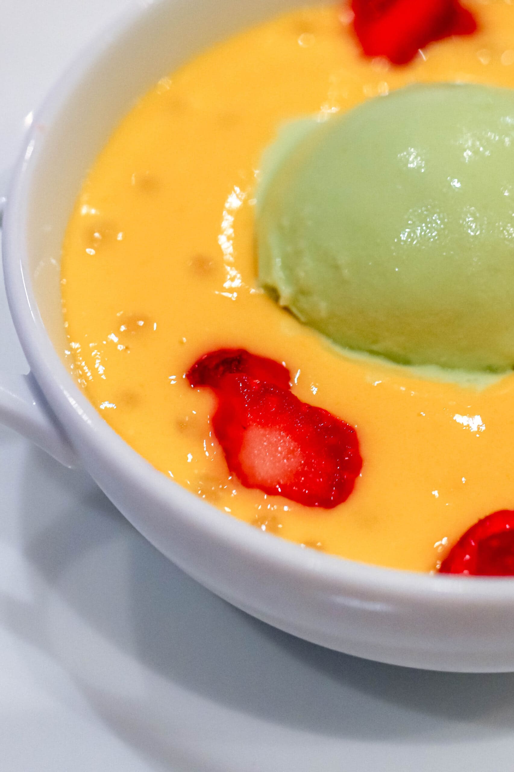 Your Ultimate Dining Guide for the Majestic Princess 19 A regal dessert experience, featuring a scoop of ice cream and a fresh strawberry, onboard the Princess Cruises’ Majestic Princess.