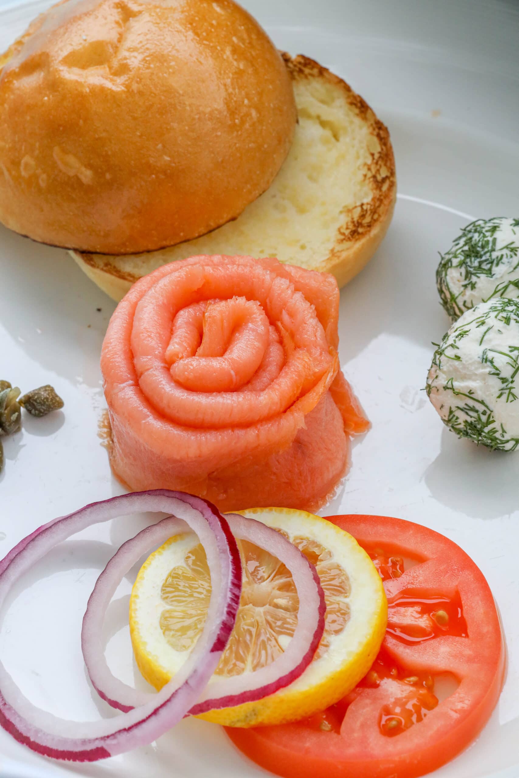 Your Ultimate Dining Guide for the Majestic Princess 42 Princess Cruises’ Majestic Princess offers a delectable feast of sandwiches adorned with onions, tomatoes, and pickles on a white plate, perfect for a gourmet experience.