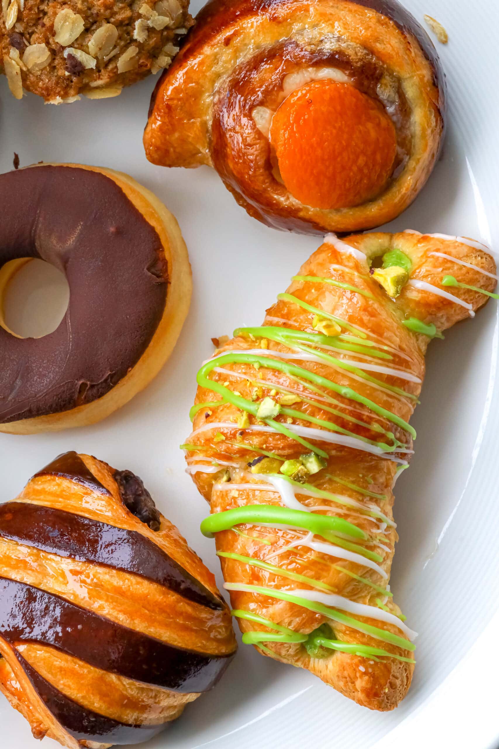 Your Ultimate Dining Guide for the Majestic Princess 38 A pristine white plate showcasing an assortment of royal pastries, perfect for a luxurious breakfast.