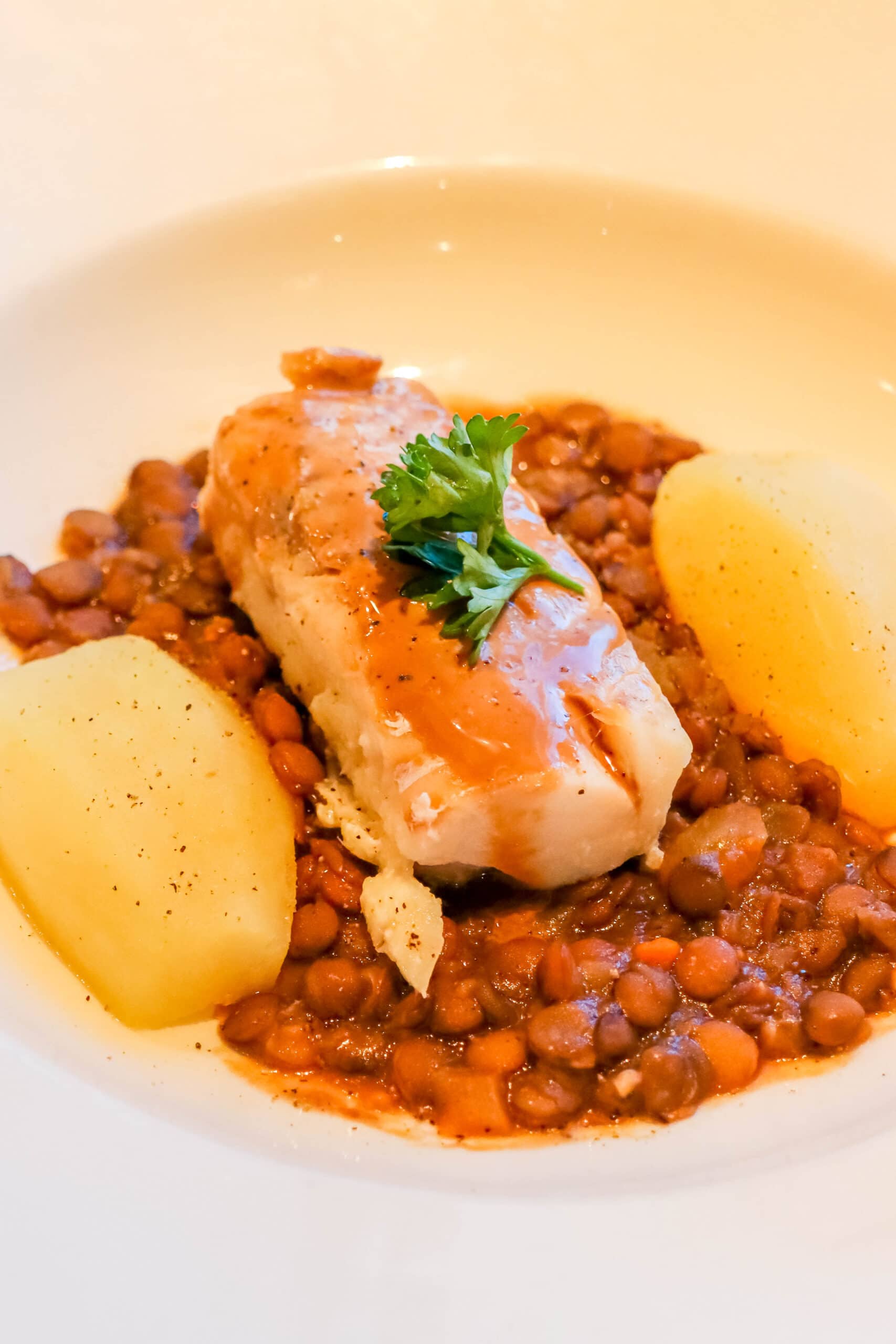 Your Ultimate Dining Guide for the Majestic Princess 25 A beautifully plated dish featuring tender fish, roasted potatoes, and fresh green beans, offering a delightful meal on the Majestic Princess.