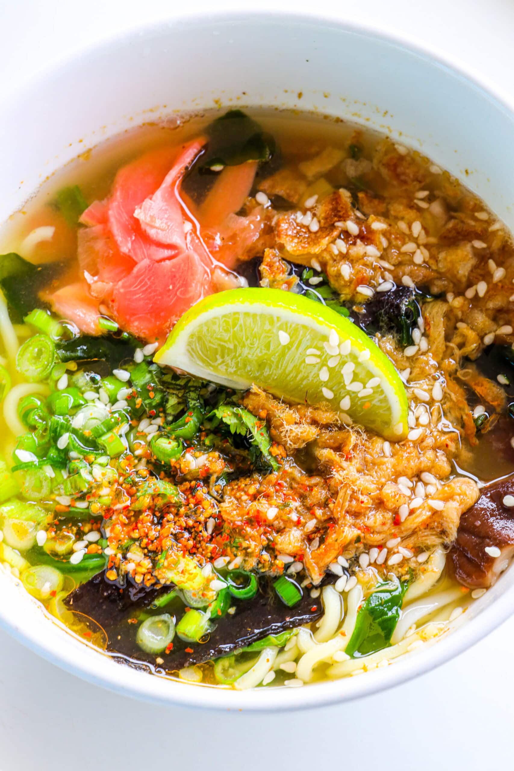 Your Ultimate Dining Guide for the Majestic Princess 31 A hearty bowl of noodle soup with a slice of lime, a comforting meal served at the Noodles Ramen Bar on Majestic Princess.