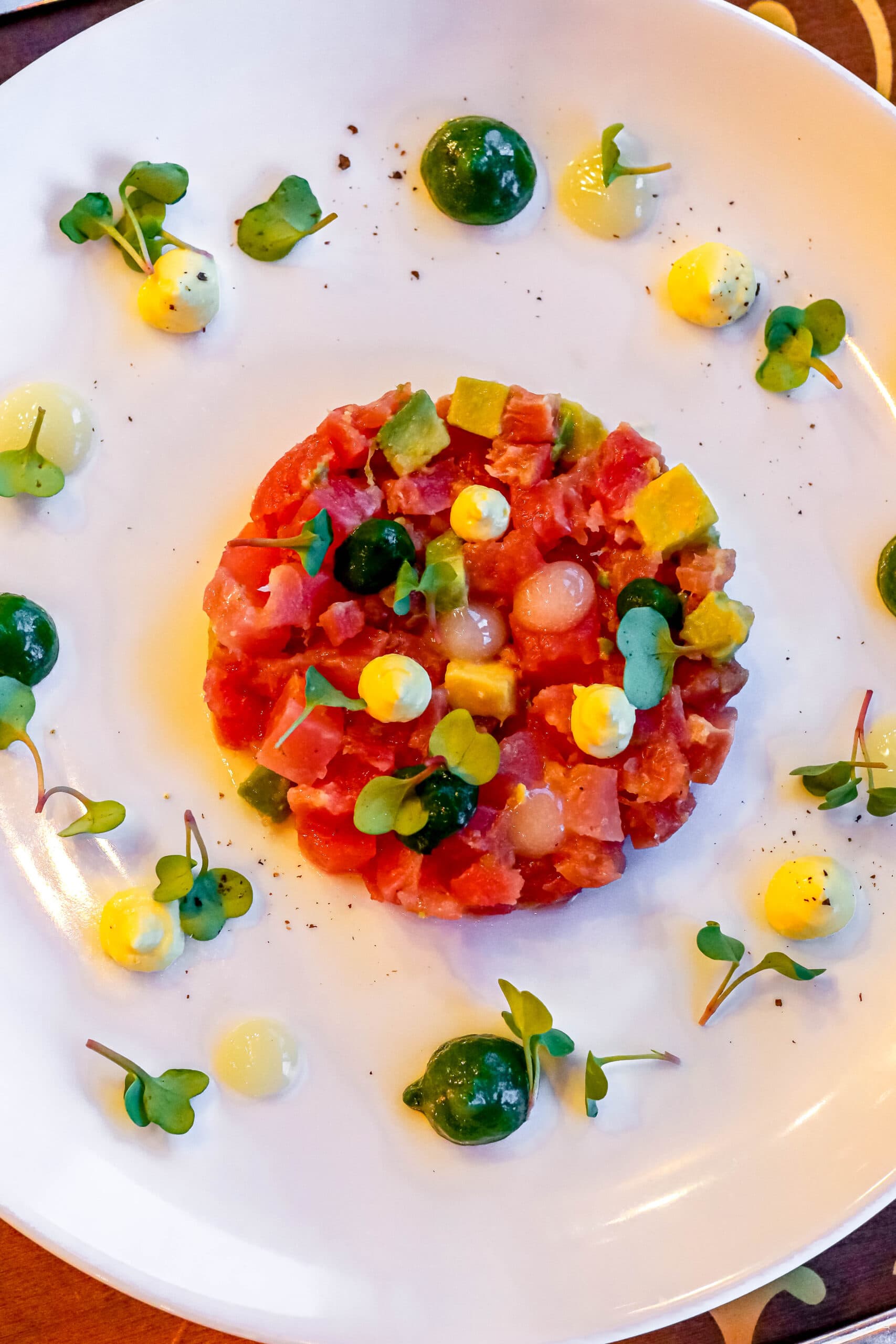 Your Ultimate Dining Guide for the Majestic Princess 3 Exquisitely plated steak tartare with delicate garnishes at Bistro Sur La Mer.