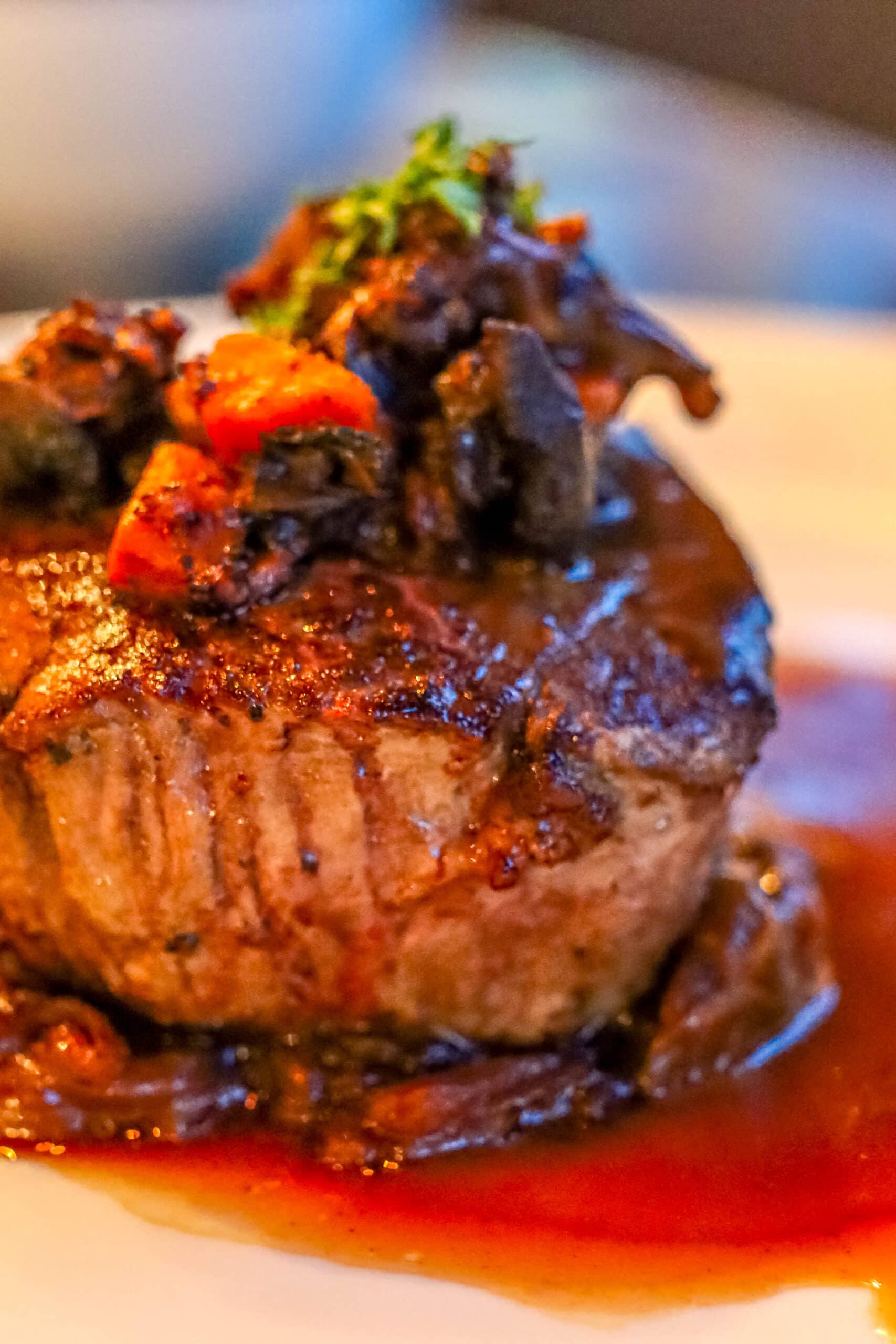 Your Ultimate Dining Guide for the Majestic Princess 4 Perfectly cooked filet mignon, tender and juicy, served with gourmet sides at Bistro Sur La Mer.
