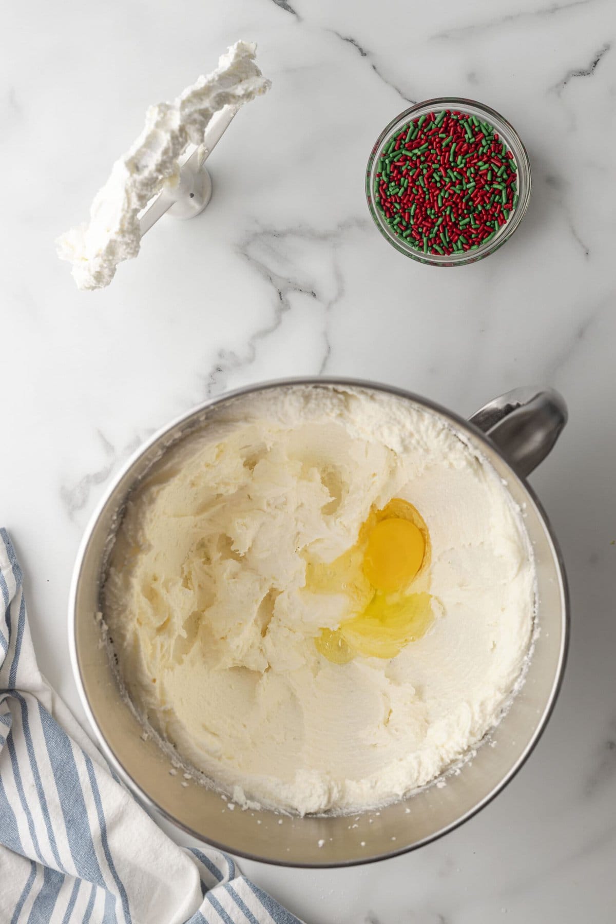 picture of creamed butter and sugar in the bowl of a stand mixer