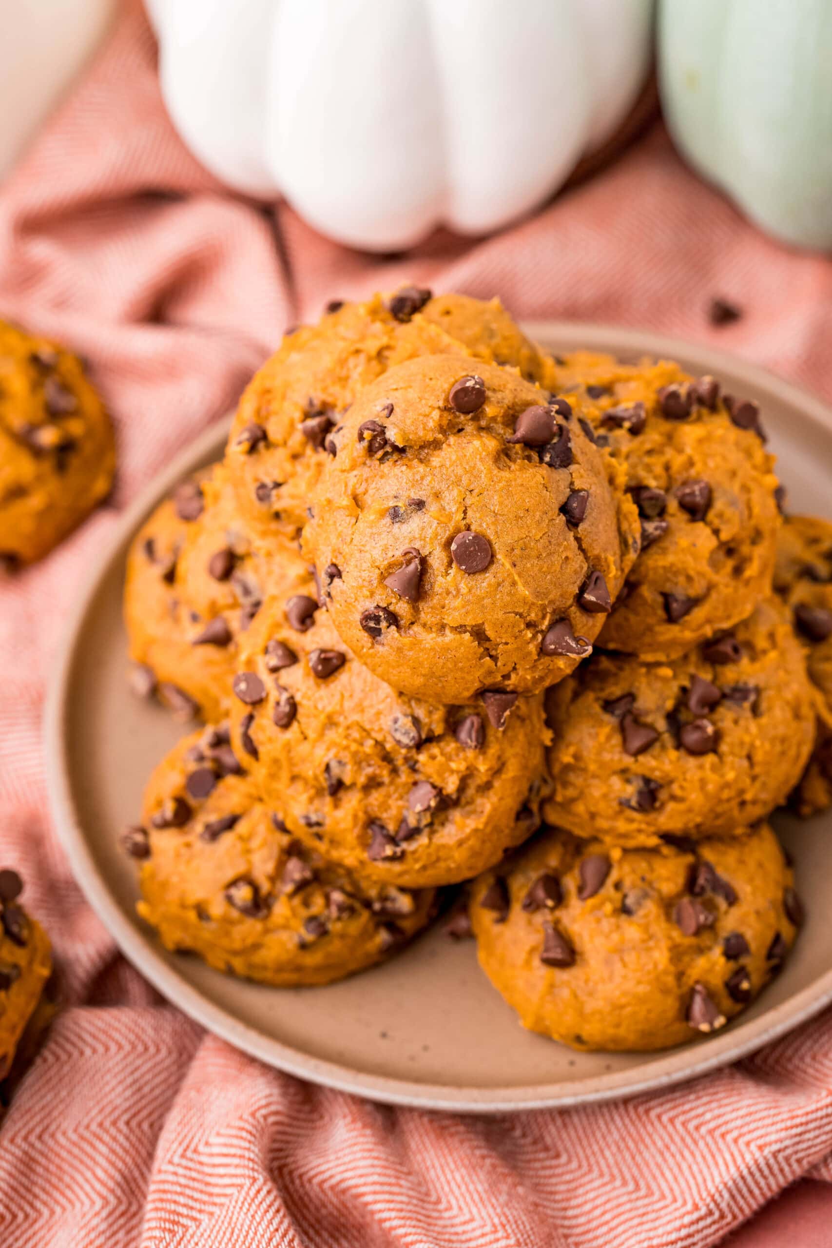Pumpkin chocolate chip cookies on a plate.