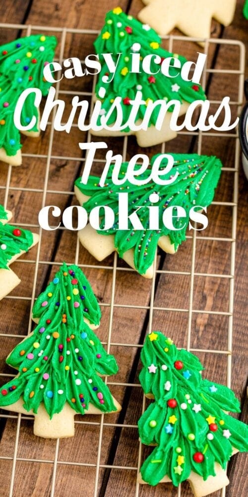 picture of iced christmas tree sugar cookies on a cooling rack