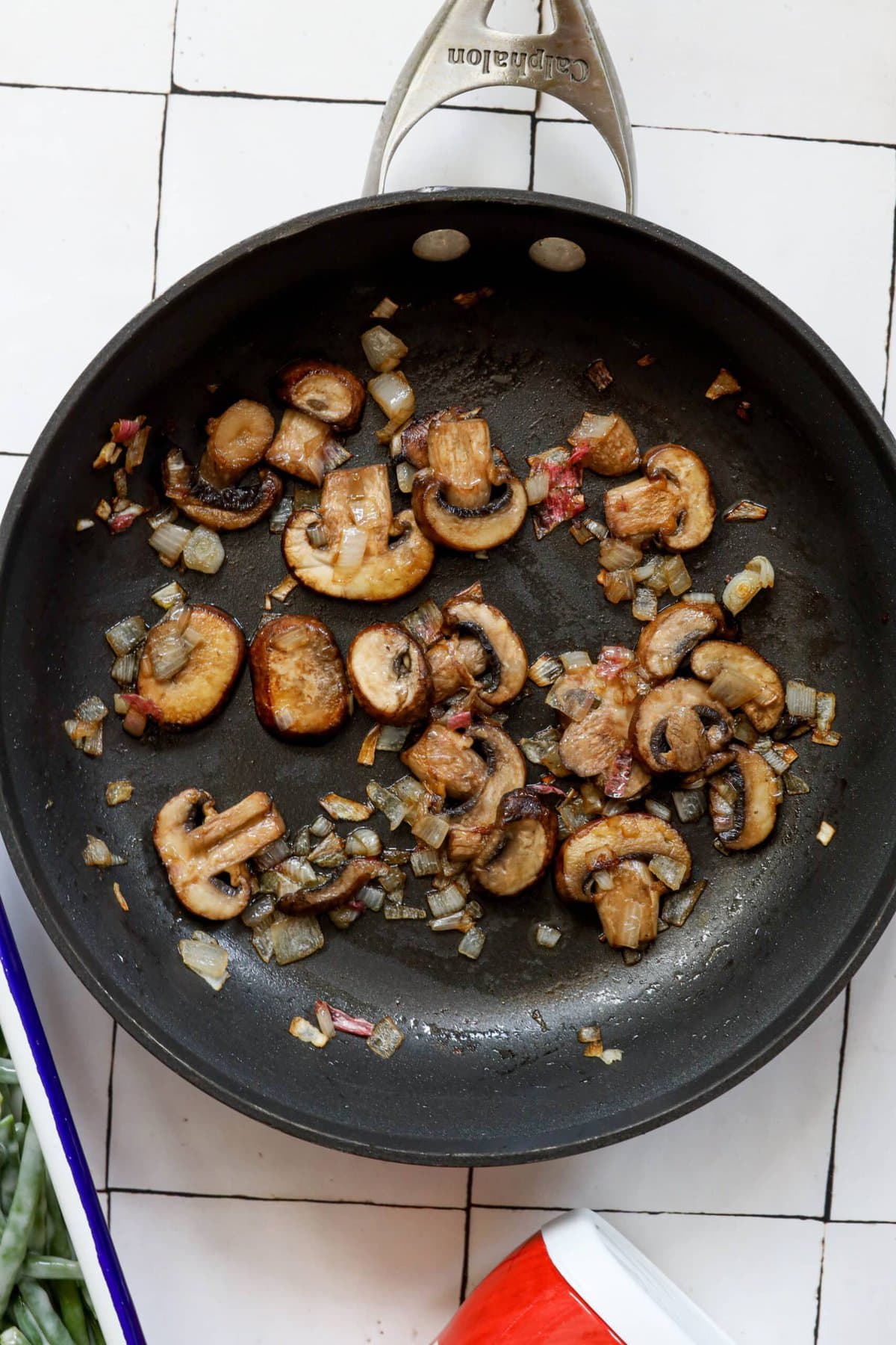 picture of mushrooms, shallot, and garlic browning in a pan