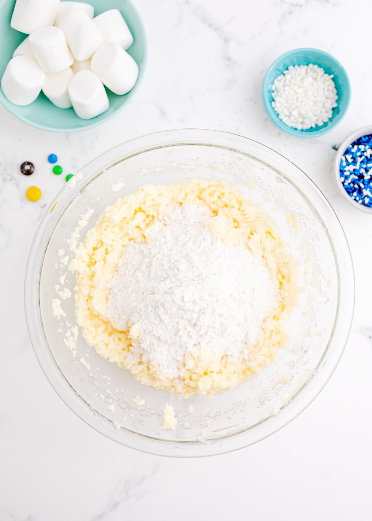 Melted Snowman Cookies with powdered sugar and other ingredients.