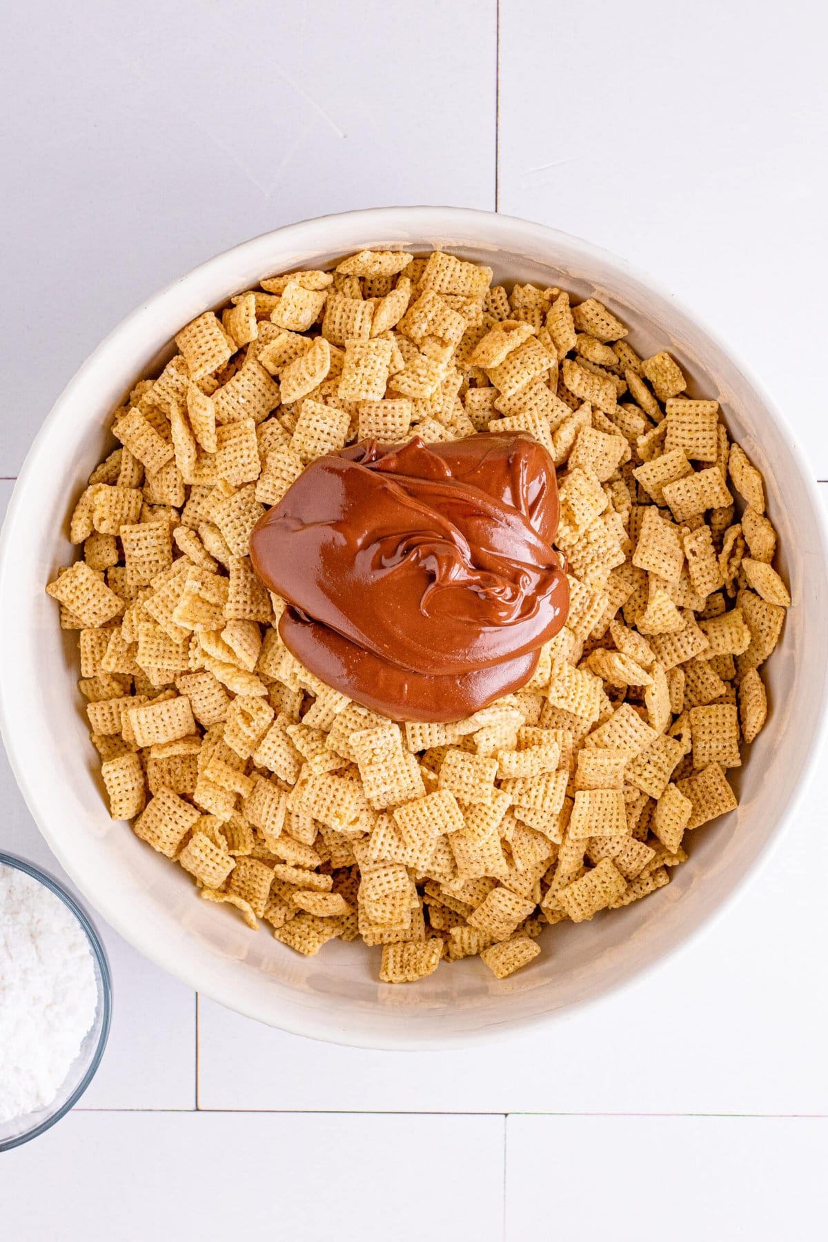 picture of melted chocolate and peanut butter over chex cereal