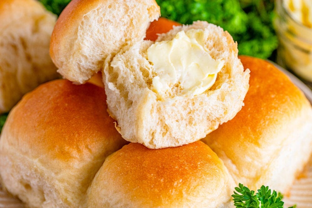 picture of yeast roll with butter on it 