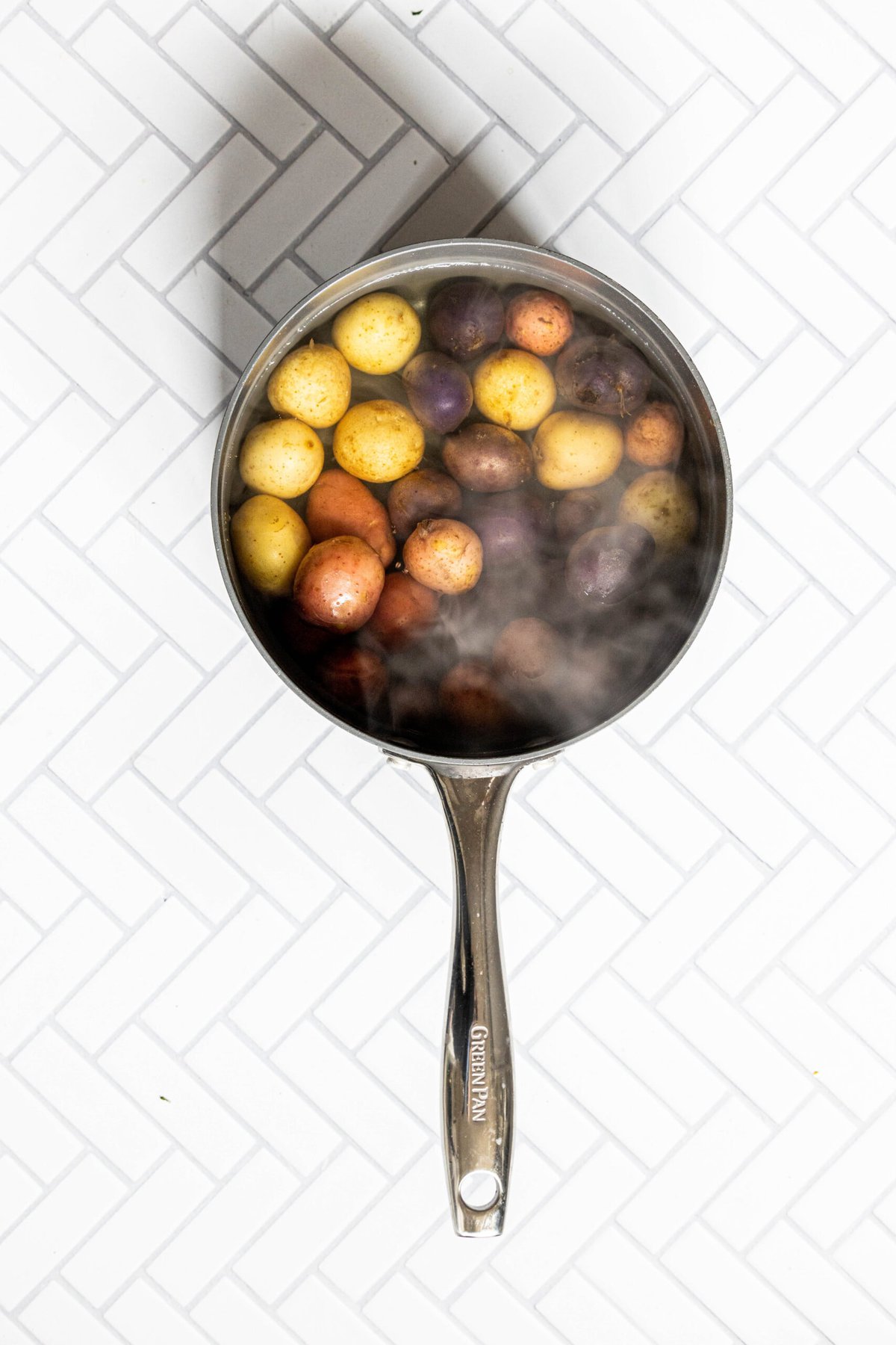picture of a pot of water with potatoes in it