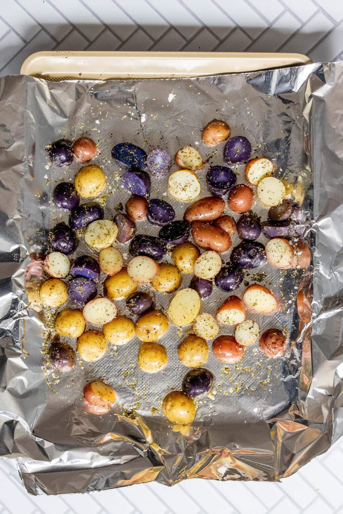 picture of potatoes on a baking sheet with foil