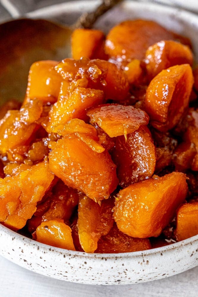 picture of candied yams in a white bowl 