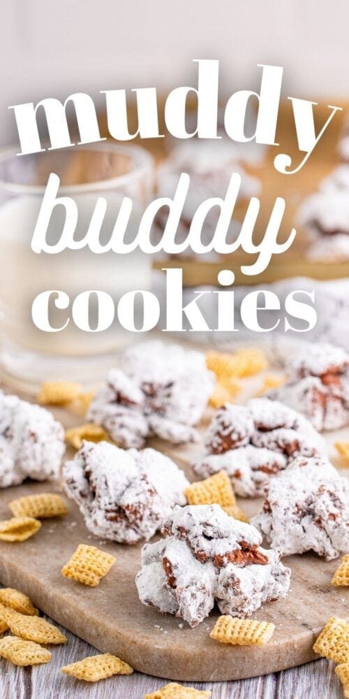 picture of muddy buddy cookies stacked on a wood cutting board