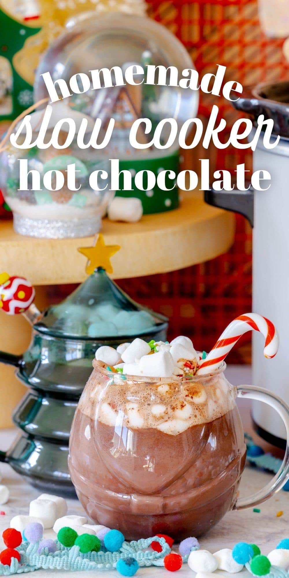 Rich and Creamy Slow Cooker Hot Chocolate 16 A serene shot of a mug of hot chocolate with a candy cane stirrer and mini marshmallows, representing the ultimate cozy beverage.