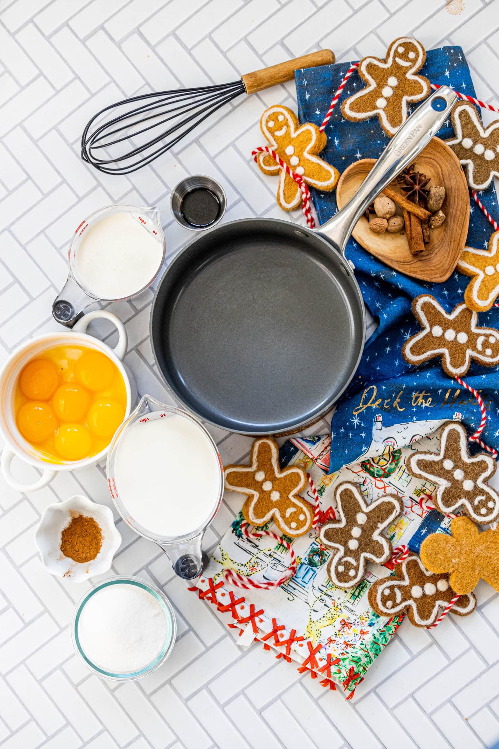 eggs, sugar, vanilla, nutmeg, cream on a table in bowls