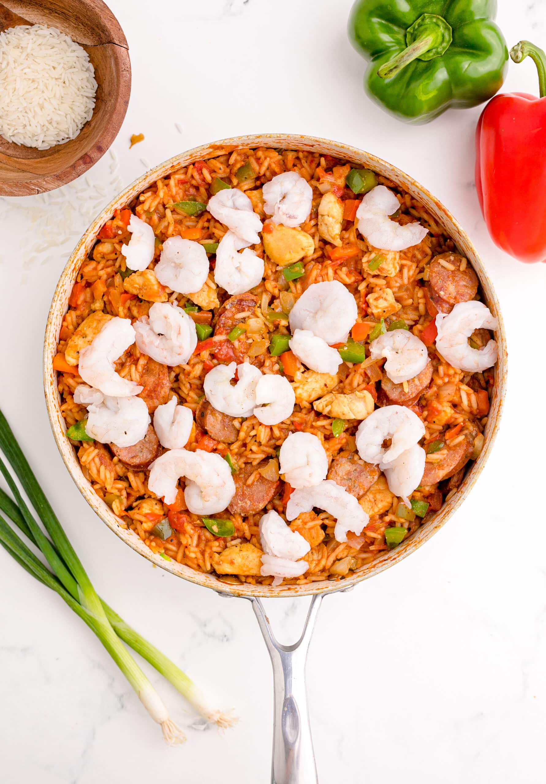 A skillet full of shrimp and peppers, creating an easy Stovetop Jambalaya.