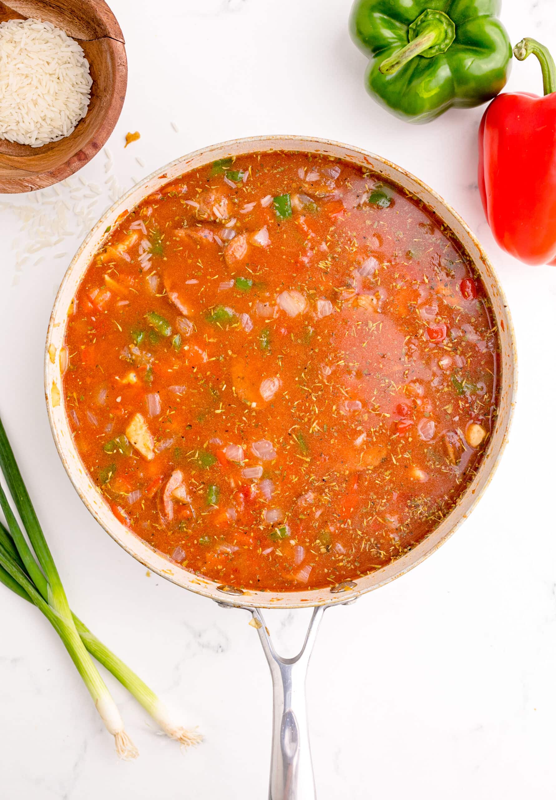 picture of jambalaya with rice cooking in a pan