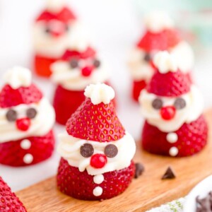 strawberry sliced and topped with whipped cream and chocolate chips to look like santa
