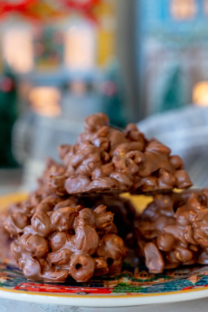 chocolate peanut cluster candies on a plate