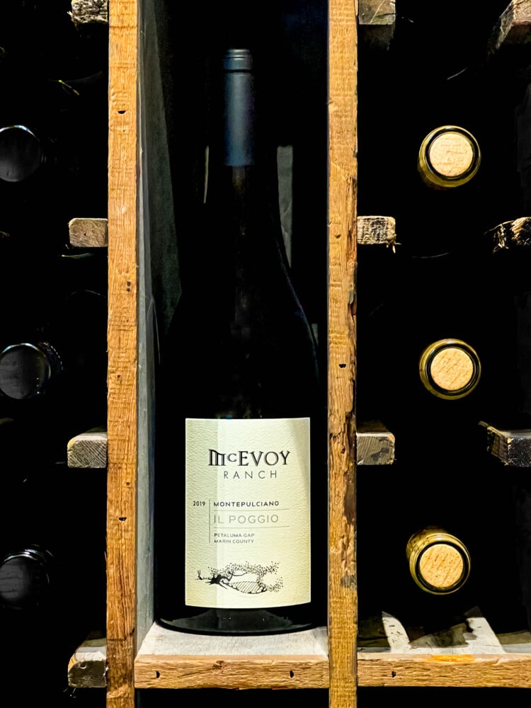 picture of mcevoy ranch wine bottle in wooden rack 
