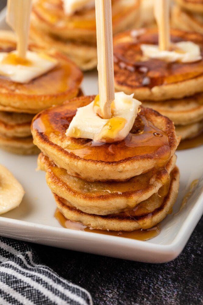 stack of pancakes with butter on top