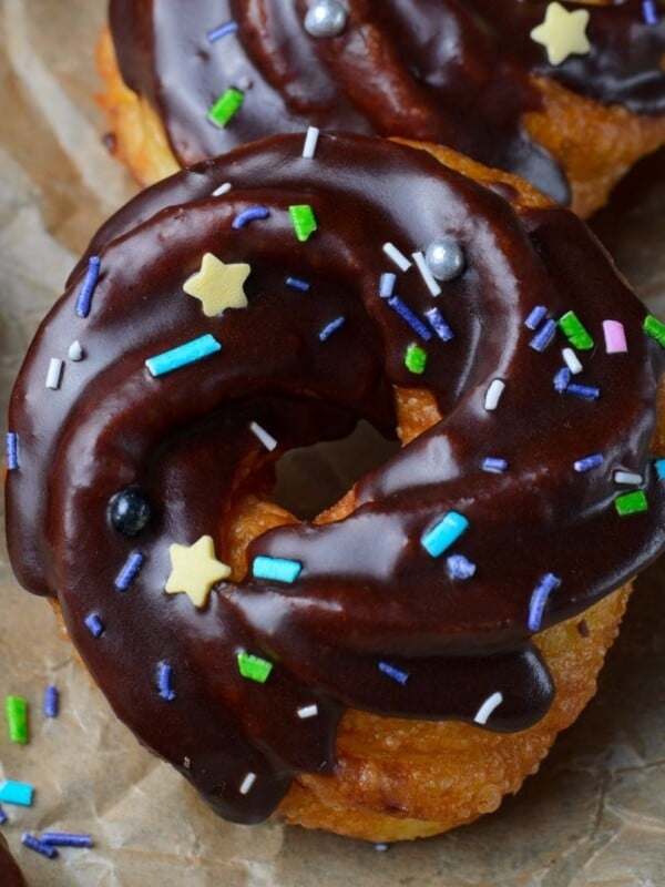picture of cruller donut with chocolate glaze and sprinkles
