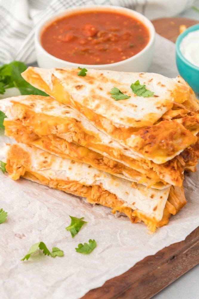 picture of chicken quesadillas in front of an instant pot