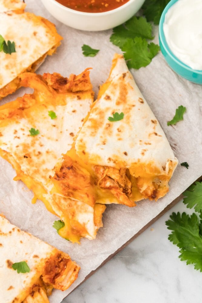 picture of chicken quesadillas in front of an instant pot