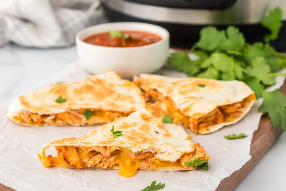 chicken quesadillas in front of an instant pot