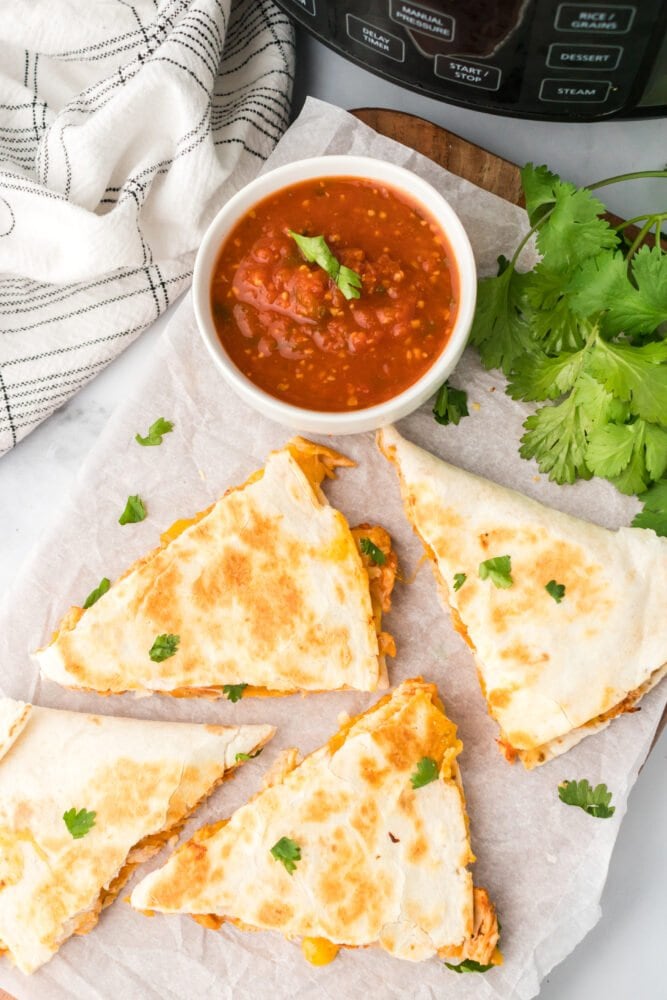 chicken quesadillas in front of an instant pot