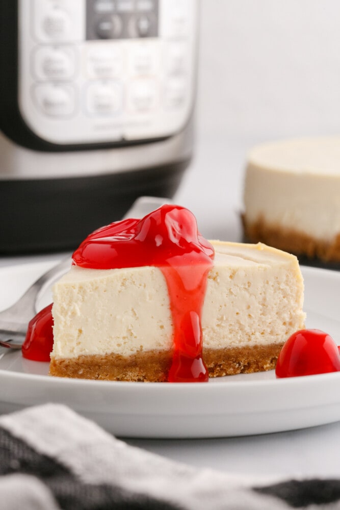 picture of cherry cheesecake in front of an instant pot