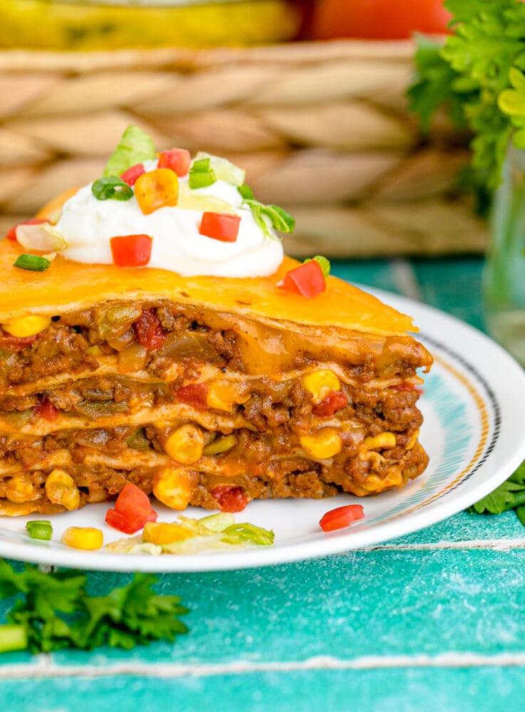 https://sweetcsdesigns.com/wp-content/uploads/2022/02/Layered-Taco-Bake-Pie-80-737x1000.jpg