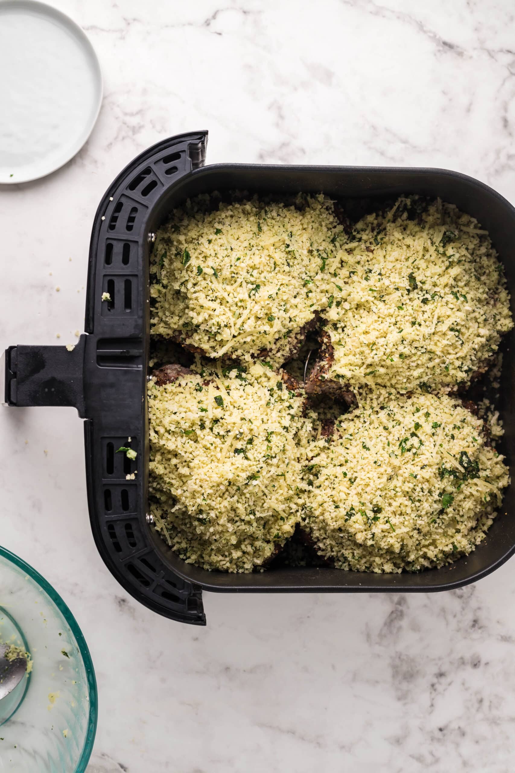 A baking dish full of stuffed mushrooms.