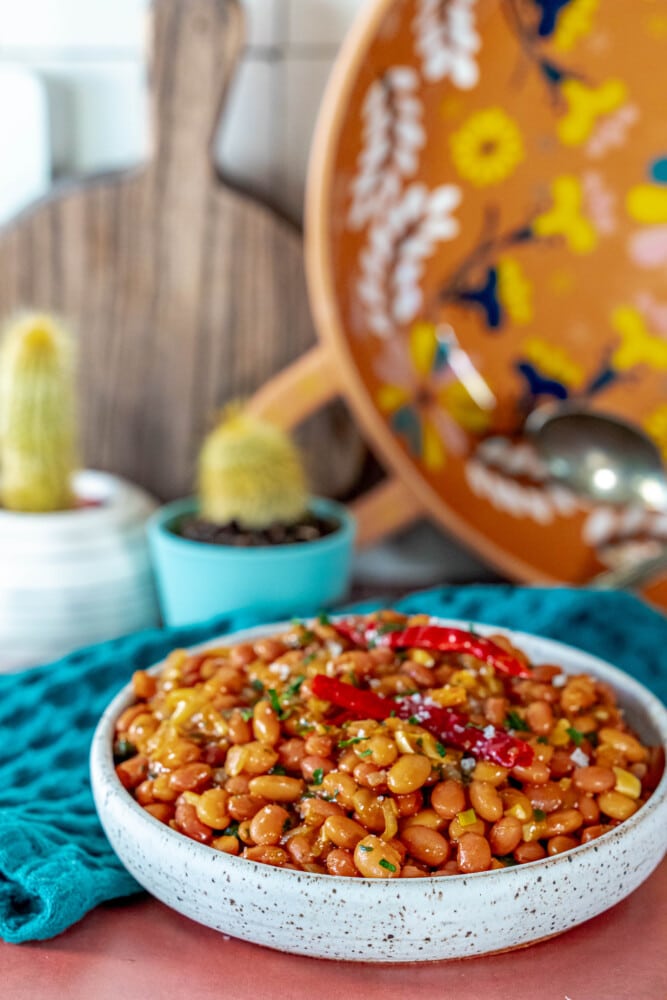 spicy garlic beans in a bowl on a table